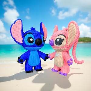 May include: Two knitted figurines of the characters Stitch and Angel from the animated film Lilo & Stitch. Stitch is blue with pink ears, and Angel is pink. They are holding hands on a sandy beach with a blue sky background.