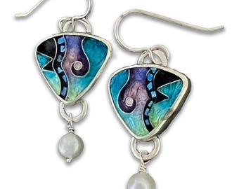 Small Triangle cloisonné earrings by Ricky Frank. Purple , teal, “Jazz”. Enamel set in sterling silver, fresh water pearl, French ear wires.