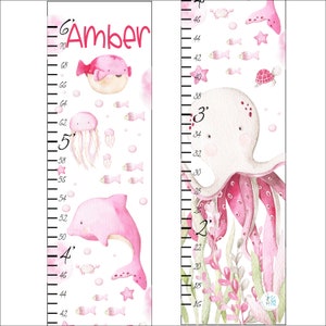 May include: A pink and white octopus with a pink and white jellyfish, a pink pufferfish, and a pink dolphin on a white background with a pink and black ruler measuring from 16 to 70 inches. The ruler is labeled with the name "Amber".