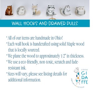 May include: A set of six wooden wall hooks and drawer pulls featuring illustrations of a brown bear, hedgehog, fox, raccoon, squirrel, and owl. The text reads WALL HOOKS AND DRAWER PULLS, followed by details about handmade maple wood construction.