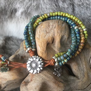 Multi strand leather silver sunflower button bracelet, bee charm, boho Picasso glass seed beads, blue, seafoam, caramel, green