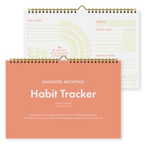 May include: An undated monthly habit tracker with a spiral design. The cover is coral with the words "Habit Tracker" in white. The interior pages have sections for daily, weekly, and monthly habits, with a quote: "The beginning is the most important part of the work."