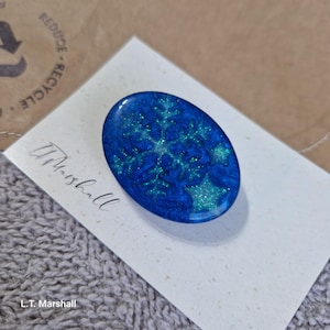 Shimmering resin snow flake brooch