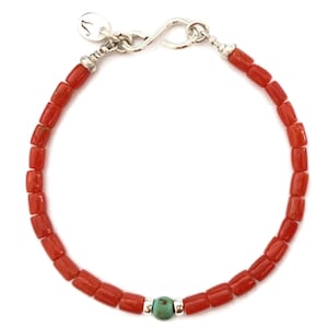 Mediterranean natural coral and a lucky turquoise bead accent. A symbol, power bracelet to wear all year long. Coral, a gift from the sea of a beautiful burnt orange-red color. Long-time symbol of happiness and luck.