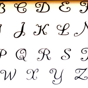 capital letters, 3mm high, in a handwriting font