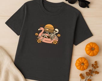 Skeleton Flamingo Float T-Shirt Halloween Summerween Shirt Spooky Beach Vibes Tee Retro Sunset Skeleton Pool Party Shirt