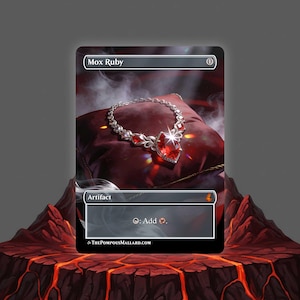 May include: A Mox Ruby card featuring a silver necklace with a large, heart-shaped red gemstone. The card is labeled "Artifact" and has the text "Mox Ruby" at the top. The background shows a red pillow and a volcanic landscape.