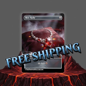 May include: A Mox Ruby card featuring a silver necklace with a large, red gemstone pendant. The card is set against a dark background with a red pillow and the text "Mox Ruby" at the top.