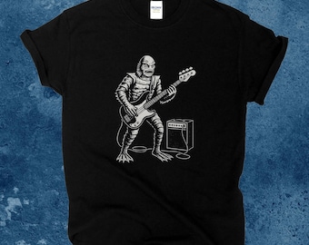 Creature from the Black Lagoon T-Shirt: Gill-Man Playing a Bass Guitar Tee Shirt