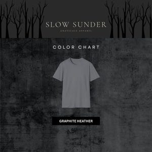 May include: A grey graphite heather t-shirt against a dark grey textured backdrop. The text "SLOW SUNDER" and "GRAYSCALE APPAREL" are at the top. Below the shirt is a black rectangle with the text "GRAPHITE HEATHER".