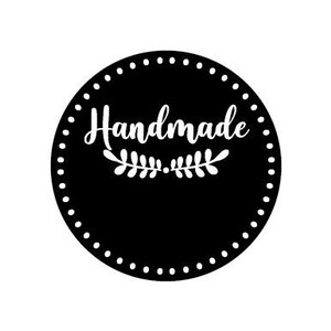 May include: Black and white circle with a dotted border and the word "Handmade" in white script with a small leaf design underneath.