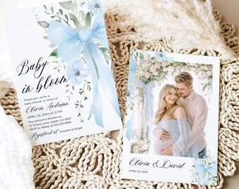 May include: Baby shower invitation with a blue watercolor bow and floral design. The invitation reads "Baby in Bloom" and includes the date, time, and location of the shower. The invitation also includes the name of the expectant parents, Olivia and David, and the date of the shower, April 22, 20XX.