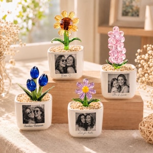 May include: Four square white ceramic planters containing glass flowers in yellow, pink, blue, and purple. Each planter features a black and white photograph of two people and text including "Besties," "Alice & Sarah," "Besties Forever," and "Love you bestie."