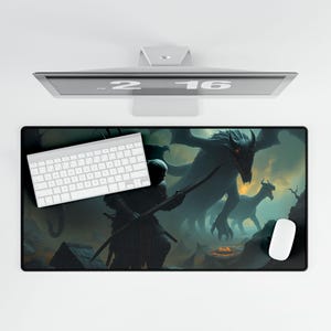 May include: A black rectangular desk mat featuring a fantasy scene with a warrior and dragons. A white keyboard and mouse are on the mat. The monitor above displays the date 2-16.