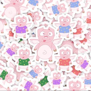May include: A collection of pink pig stickers with angel wings. The pigs wear different colored shirts with star and moon designs. The stickers are on a white background and vary in size and pose.