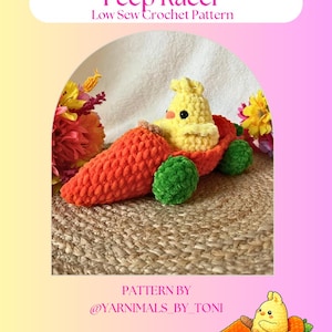 May include: A handmade crochet toy car featuring a yellow chick in a carrot-shaped vehicle with green wheels. The image includes the text "Peep Racer" and "Low Sew Crochet Pattern". The pattern is by @YARNIMALS_BY_TONI.