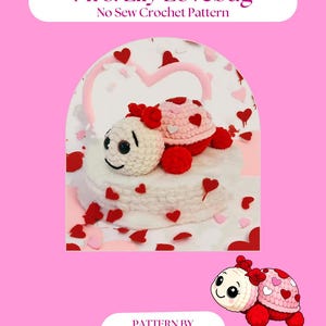 May include: A crochet pattern titled "Mrs. Lily Lovebug" with a pink background. The image features a white and pink crocheted lovebug with red heart accents. The text "No Sew Crochet Pattern" is also visible.