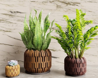 May include: Three decorative planters with live plants. The planters are brown, yellow, and maroon with a geometric design. The plants include a snake plant, a ZZ plant, and a succulent.
