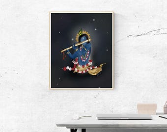 May include: A framed artwork depicts a blue-skinned figure playing a flute. The figure is adorned with a peacock feather, a floral garland, and gold accents. The background is dark with scattered white dots, suggesting a starry night.