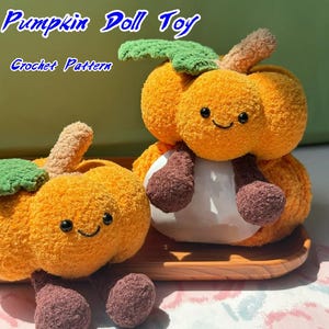 May include: Two plush pumpkin dolls with smiling faces, green leaves, and brown stems. The dolls are orange with brown and white accents. The text "Pumpkin Doll Toy" and "Crochet Pattern" are in the image.