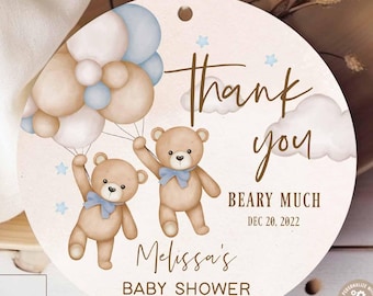 May include: Round baby shower tag with two teddy bears holding balloons. The tag reads "Thank you BEARY MUCH" and "Melissa's BABY SHOWER" with the date. The tag has a string for hanging and a watercolor design.