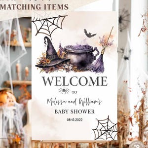 May include: A Halloween-themed baby shower welcome sign on an easel. The sign features a witch's hat, cauldron, broom, and spiderwebs. The text reads "Welcome to Melissa and William's Baby Shower 08.15.2022". The search term "48V1" is at the top.