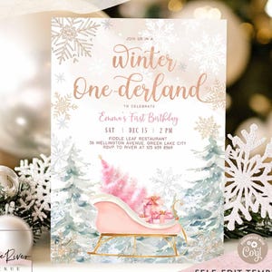 May include: A winter-themed invitation with the text "Winter One-derland" for a first birthday celebration. The design features a pink sleigh with gifts, snowflakes, and a watercolor forest. The invitation includes event details and the text "Matching Items Available."