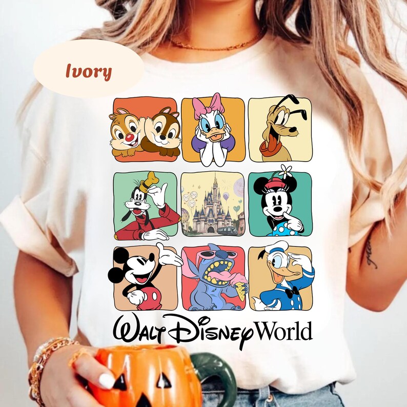 May include: Ivory-colored t-shirt featuring a grid of Disney characters including Chip and Dale, Daisy Duck, Goofy, Mickey Mouse, Minnie Mouse, Stitch, and Donald Duck. The words "Walt Disney World" are printed below the grid.