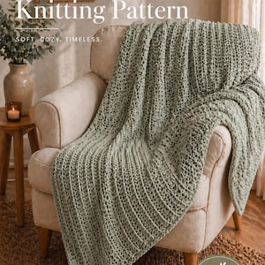 May include: A sage green knitted blanket draped over a beige armchair. The blanket has a textured, ribbed pattern. Text on the image reads "Sage Green Knitting Pattern" and "Handmade with Love". The blanket is described as "Soft, Cozy, Timeless."