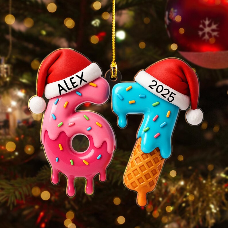 May include: Two Christmas ornaments shaped like the numbers 6 and 7. The number 6 is pink and donut-shaped with the name "ALEX" on a Santa hat. The number 7 is blue with a waffle cone base and the year "2025" on a Santa hat.