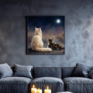 May include: A modern living room with a dark gray sectional sofa, a square coffee table, and a blue rug. A framed painting of two cats under a night sky hangs on the wall. Lit candles and books are on the coffee table.
