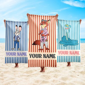 May include: Three beach towels with cartoon characters and vertical stripes. One towel is blue with Judy Hopps, another is red with Nick Wilde, and the third is blue with a snake. Each towel has the text "YOUR NAME".