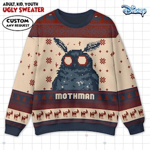 May include: An ugly sweater with a Mothman design. The sweater is cream-colored with a blue Mothman graphic in the center. The top and bottom of the sweater have a dark blue and red pattern. The text "MOTHMAN" is below the graphic.