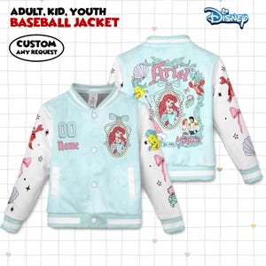 May include: Light blue baseball jacket with white sleeves. The jacket features a design of Ariel from The Little Mermaid, with the text "Ariel" and "Mermaid". The sleeves have illustrations of sea creatures and bows. The front has a custom name and number area.
