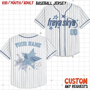 May include: White baseball jersey with blue pinstripes. The front features the text "freya skye" and "00". The back displays "YOUR NAME" above a star graphic with "Silent Treatment" and "FREYA SKYE".