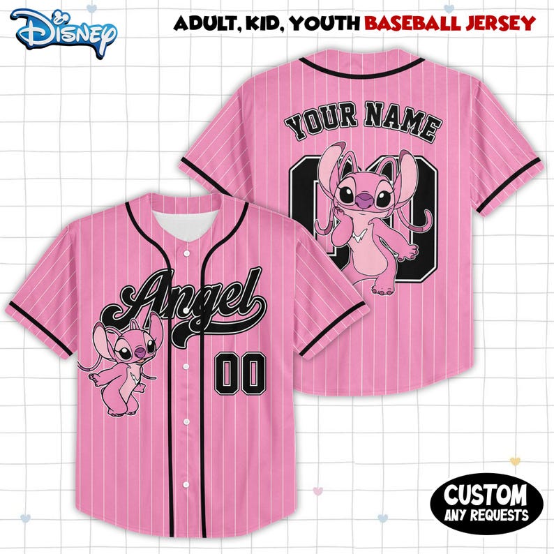 May include: Pink baseball jersey with black pinstripes, featuring the word "Angel" and the number "00". The jersey has a cartoon character on the front and back. The text "YOUR NAME" is on the back.