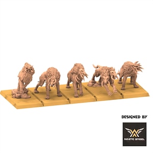 May include: Five beige-colored miniature lion-like creatures with large tusks and manes are displayed on individual rectangular bases. The creatures are in various poses, some standing and others crouching, with a detailed design. The White Angel logo is in the bottom right corner.