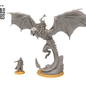 May include: A grey fantasy miniature set depicting a winged dragon ridden by a figure with a staff, and a smaller figure on a base. The set is labelled "Designed by Davale Games".