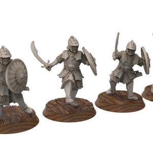 May include: Four gray miniature figurines of armored warriors, each posed with a curved sword and shield. The figures stand on individual wooden bases, suggesting a tabletop game or collectible item. The warriors wear helmets and detailed armor.