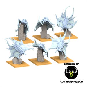May include: Six light blue fantasy creature miniatures with large, wing-like appendages, perched on gray stone-like structures atop tan bases. The creatures have detailed, textured bodies and open mouths. The image includes the text "DESIGNED BY" and "CLAYBEASTCREATION".