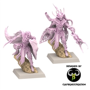 May include: Two light purple fantasy warrior figurines standing on tan, textured rock bases. Each figure wears intricate armor with flowing capes and holds a weapon. The text "DESIGNED BY CLAYBEASTCREATION" appears in the bottom right corner.