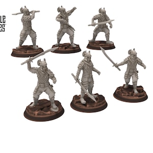 May include: Six miniature warrior figurines, each holding a sword. The figures are in detailed armour and helmets, standing on textured, brown circular bases. The words "DESIGNED BY DAVALE GAMES" are printed on the upper left.