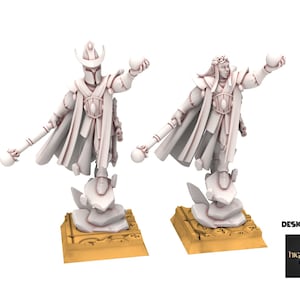 May include: Two white fantasy figurines, one with a helmet and the other with a crown, each holding a sphere and a staff. They stand on a stone base atop a gold-colored platform. The figurines are designed by highlands miniatures.