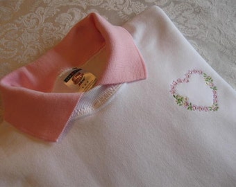 Machine Embroidered Pink Floral Heart on a White Sweatshirt with a Pink Polo Collar