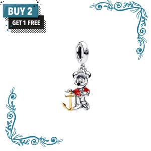 May include: A silver charm featuring a cartoon mouse character wearing a red jacket and a cap, holding a gold-coloured anchor. The charm includes a circular bail with engraved text. The image also displays a black and blue graphic with the text BUY 2 GET 1 FREE.