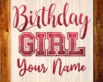 May include: A DTF transfer with the words "Birthday GIRL Your Name" in a glittery red font. The word "GIRL" is in a collegiate style font. The background is a light wood grain pattern, with the words "DTF TRANSFER" and "READY TO PRESS" in yellow.