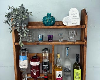 A rustic wall mounted optics shelf