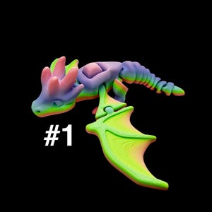 May include: A colorful 3D-printed dragon figurine with a rainbow gradient. The dragon has a detailed design with wings, a tail, and the number "#1" in white. The color scheme includes shades of blue, green, pink, and yellow.