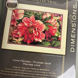 May include: A Dimensions Gold Collection counted cross stitch kit titled Coral Peonies, designed by Rachel Perry. The packaging features a floral image of vibrant coral and pink peony blossoms with green leaves, a thread organizer, and text.