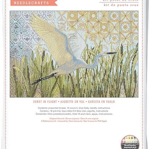 May include: Cross stitch kit featuring an egret in flight over tall grass. The kit includes pre-sorted thread, a 14-count light blue Aida cloth, a needle, and instructions. Finished size is 14 inches by 9 inches.
